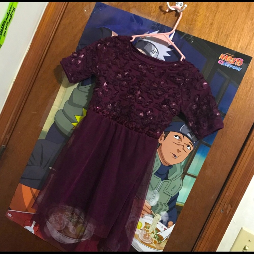 Purple and maroon dress with false flowers on the top half.